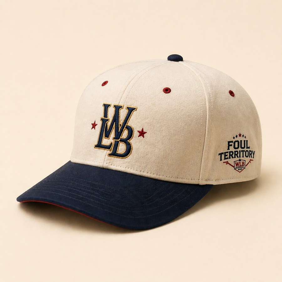 Heritage cream-and-navy baseball snapback with embroidered WLB monogram and a Foul Territory mark on the side panel